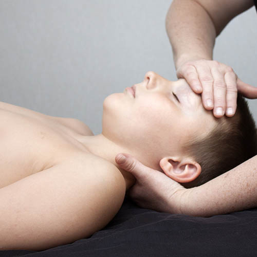 young child getting bowenwork treatment